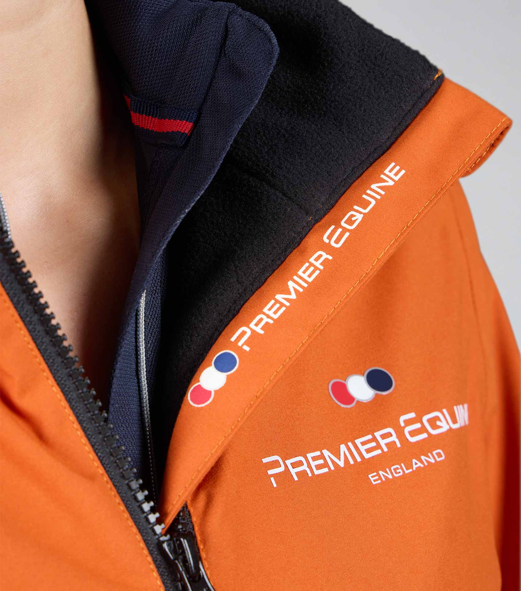 Premier Equine Omnia Women's Waterproof Riding Jacket - Burnt Orange. Equestrian Apparel.