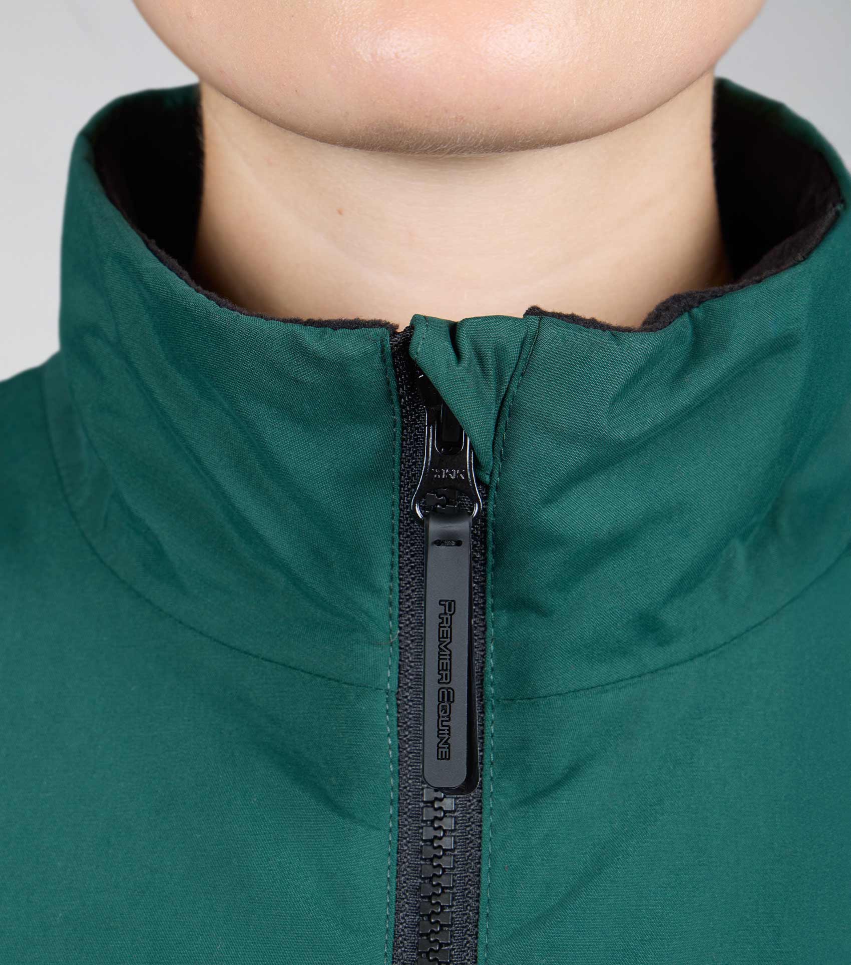 Premier Equine Omnia green waterproof riding jacket collar detail. Women's equestrian apparel.