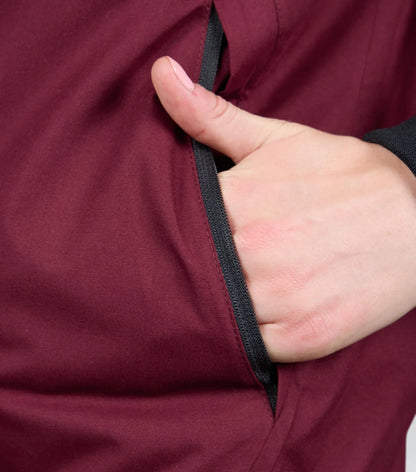 Premier Equine Women's Waterproof Riding Jacket - Wine. Hand in pocket detail.