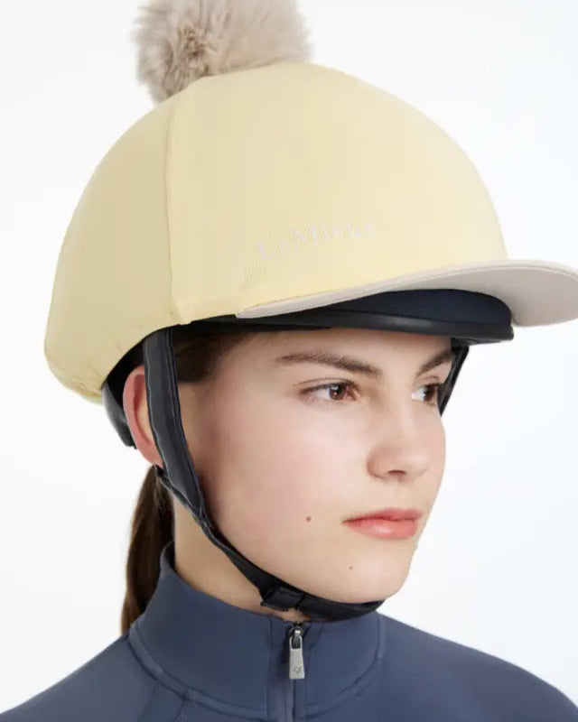 LEMIEUX Pom Hat Silk Mimosa/Stone: Stretch Fabric Equestrian Helmet Cover with Detachable Faux Fur Pom Pom - Equiflair