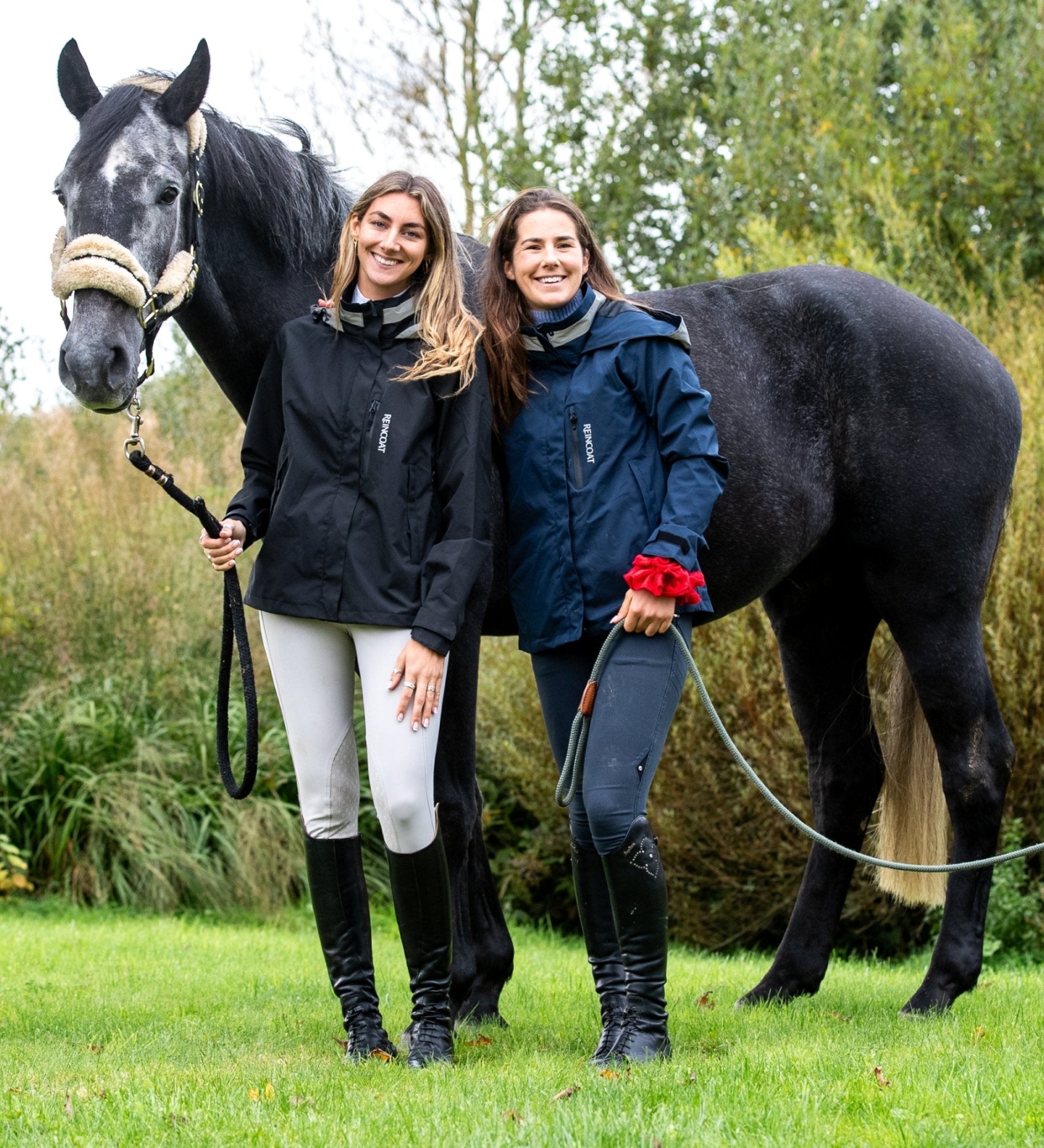 Reincoat Air: Women's waterproof horse riding jacket in black and navy with horse. Equestrian outerwear.