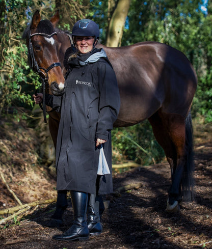 Equestrian Raincoat: Woman & Horse in Equiflair REINCOAT LITE Waterproof Riding Coat - Black