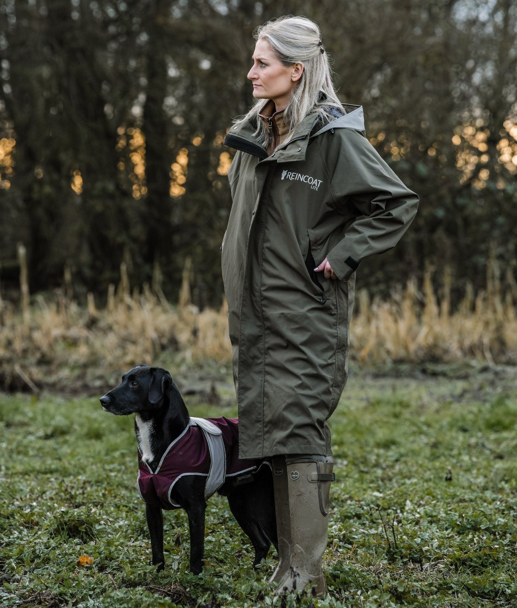 Reincoat Lite Adult Olive Waterproof Coat: Woman and Dog Walking in Countryside. Equiflair Outdoor Apparel
