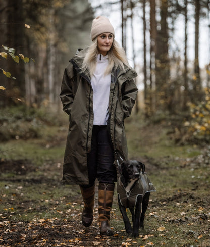 Reincoat Lite Adult Olive: Woman Walking Dog in Waterproof Coat | Equiflair
