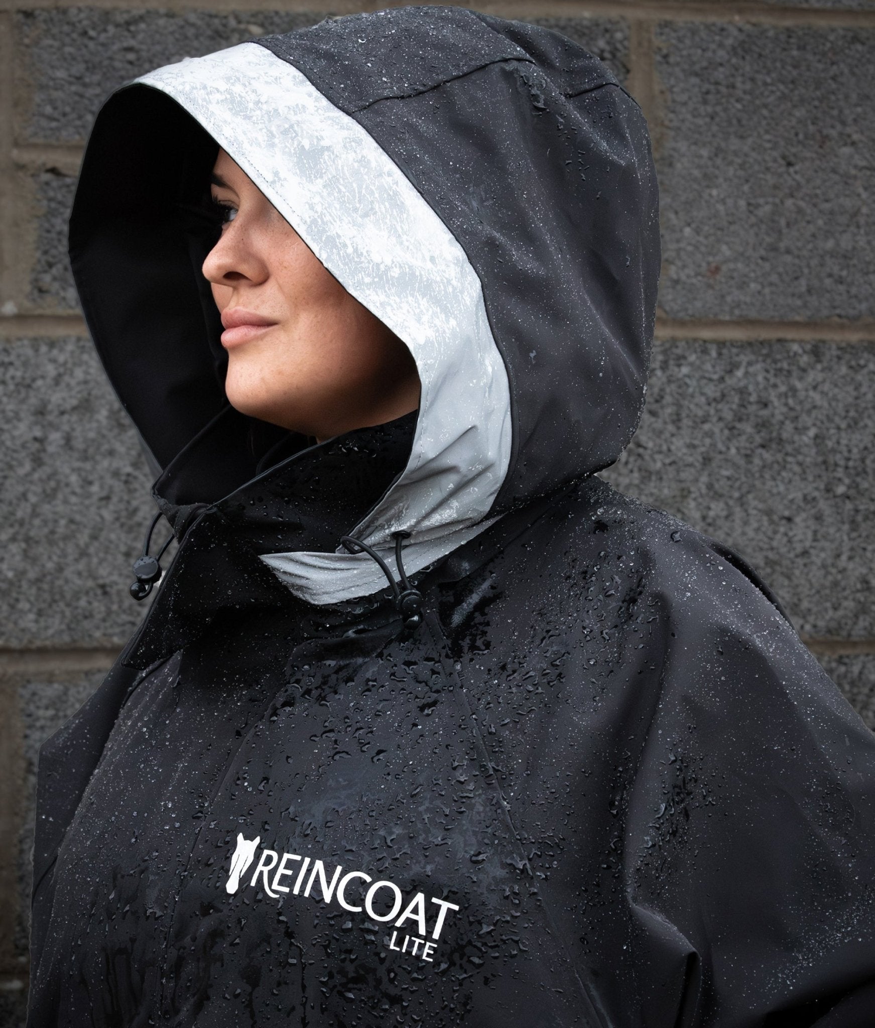 REINCOAT LITE Adult - Black Waterproof Raincoat with Hood. Equiflair Rain Jacket for Women. Rainwear with Reflective Safety Panels.