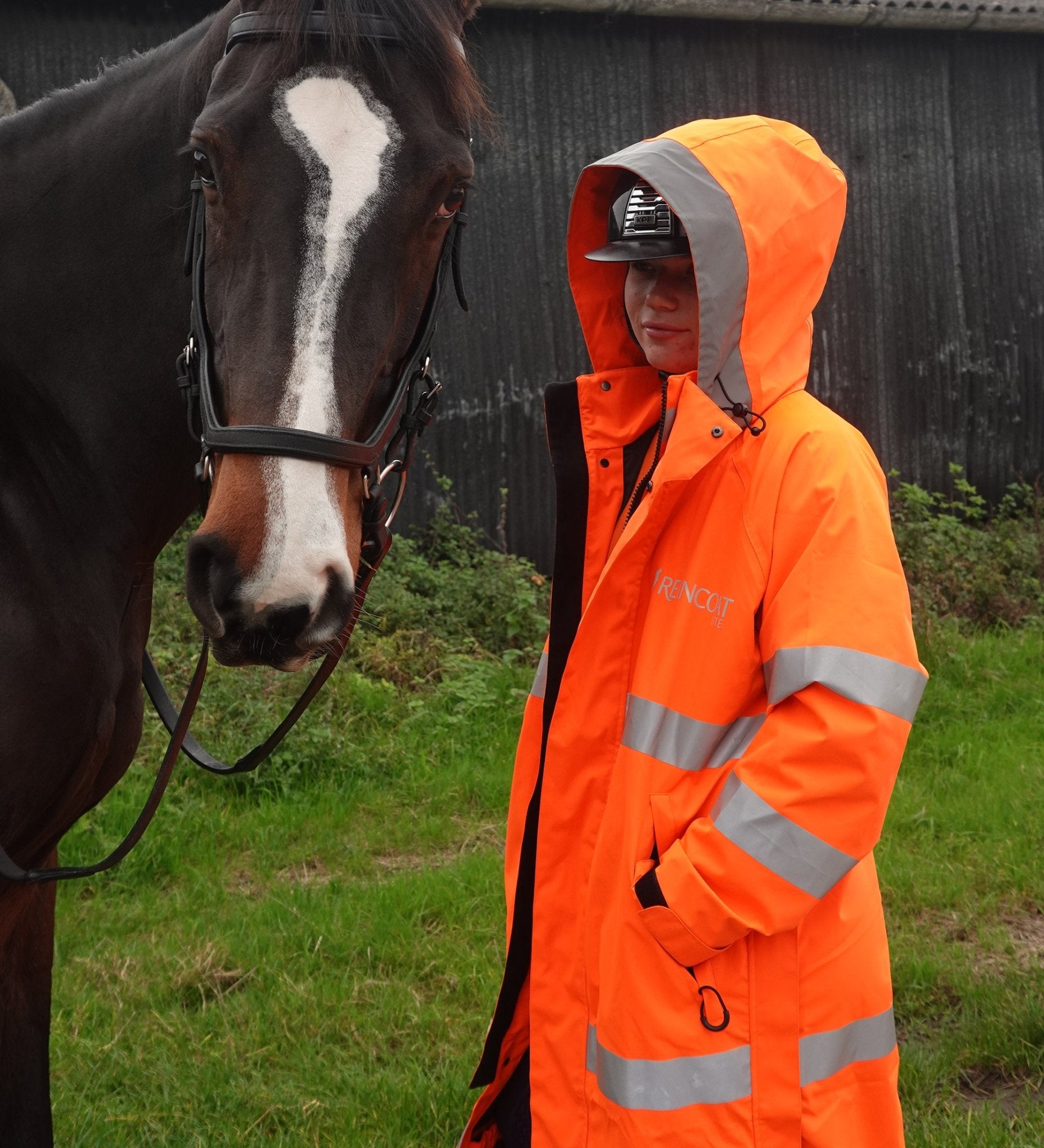 Reincoat Lite Kids - Hi-Vis Orange Riding Coat. High Visibility Safety Jacket for Children. Equiflair Brand.
