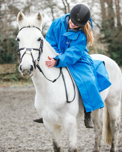 Woman on Horse in Blue Horse Riding Raincoat - Waterproof Adult Equestrian Gear