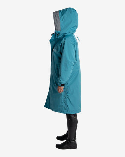 Reincoat Pro Adult - Teal Waterproof Riding Coat - Equiflair. Full-length, hooded, and stylish protection from the elements!
