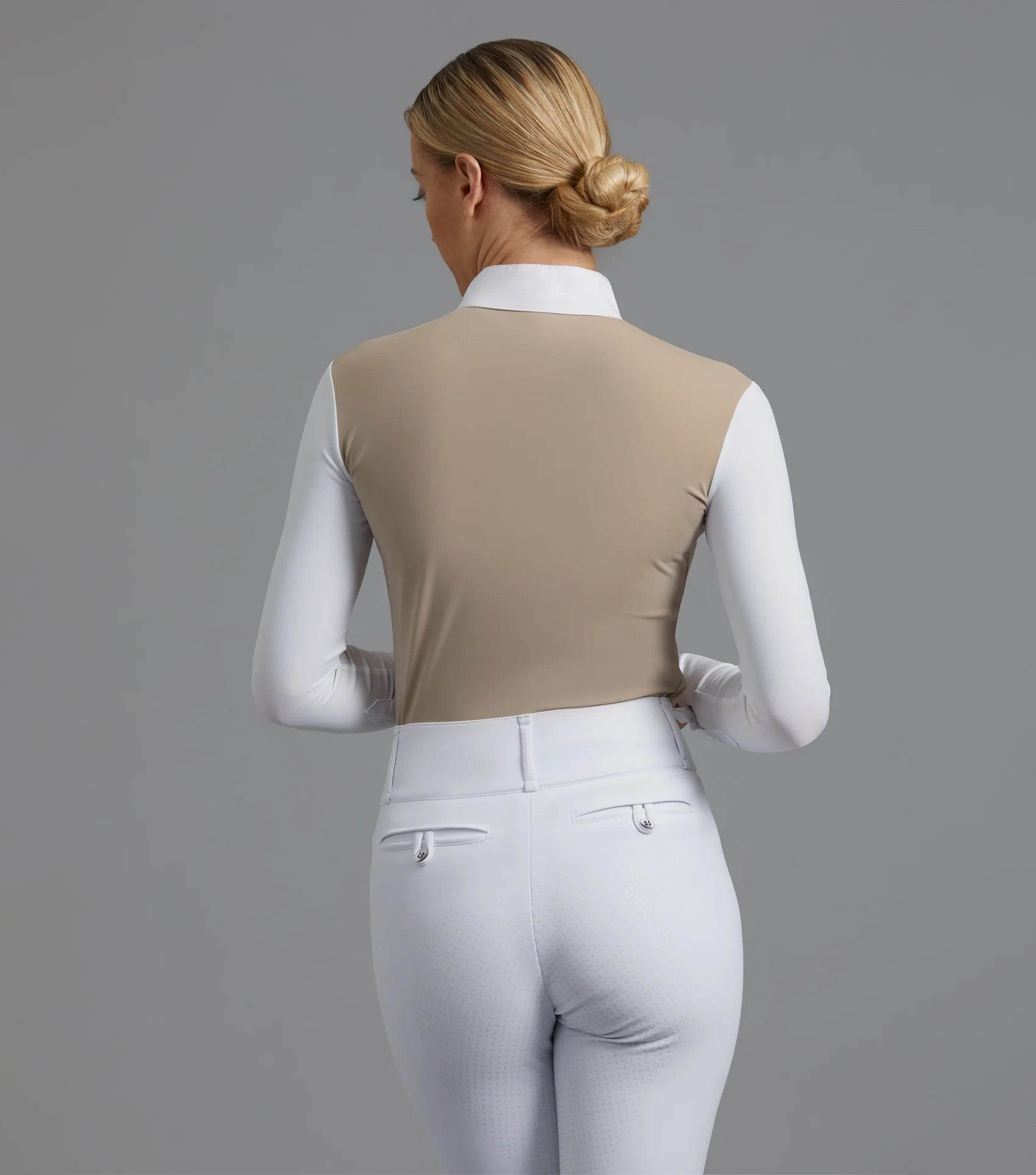 Equestrian show shirt: beige competition top, white breeches. Breathable, moisture-wicking riding apparel.