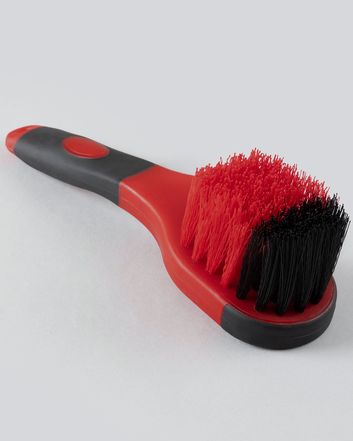 PREMIER EQUINE SOFT-TOUCH BUCKET BRUSH BLACK & RED. Red and black cleaning brush with black and red bristles.