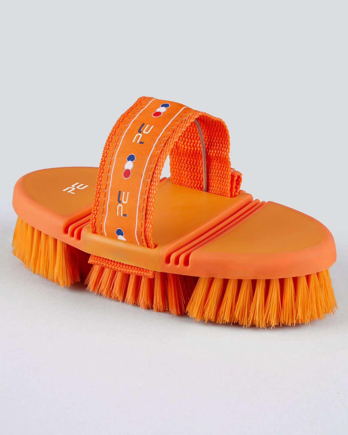 Premier Equine orange & amber soft-touch flexi body brush for horse grooming. Flexible handle, soft bristles.