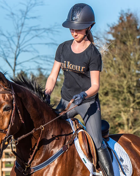 Equestrian girl wearing Charles Owen SP8 Plus sparkly riding helmet. Wide brimmed, sun protection, navy. #Equestrian #RidingHelmet