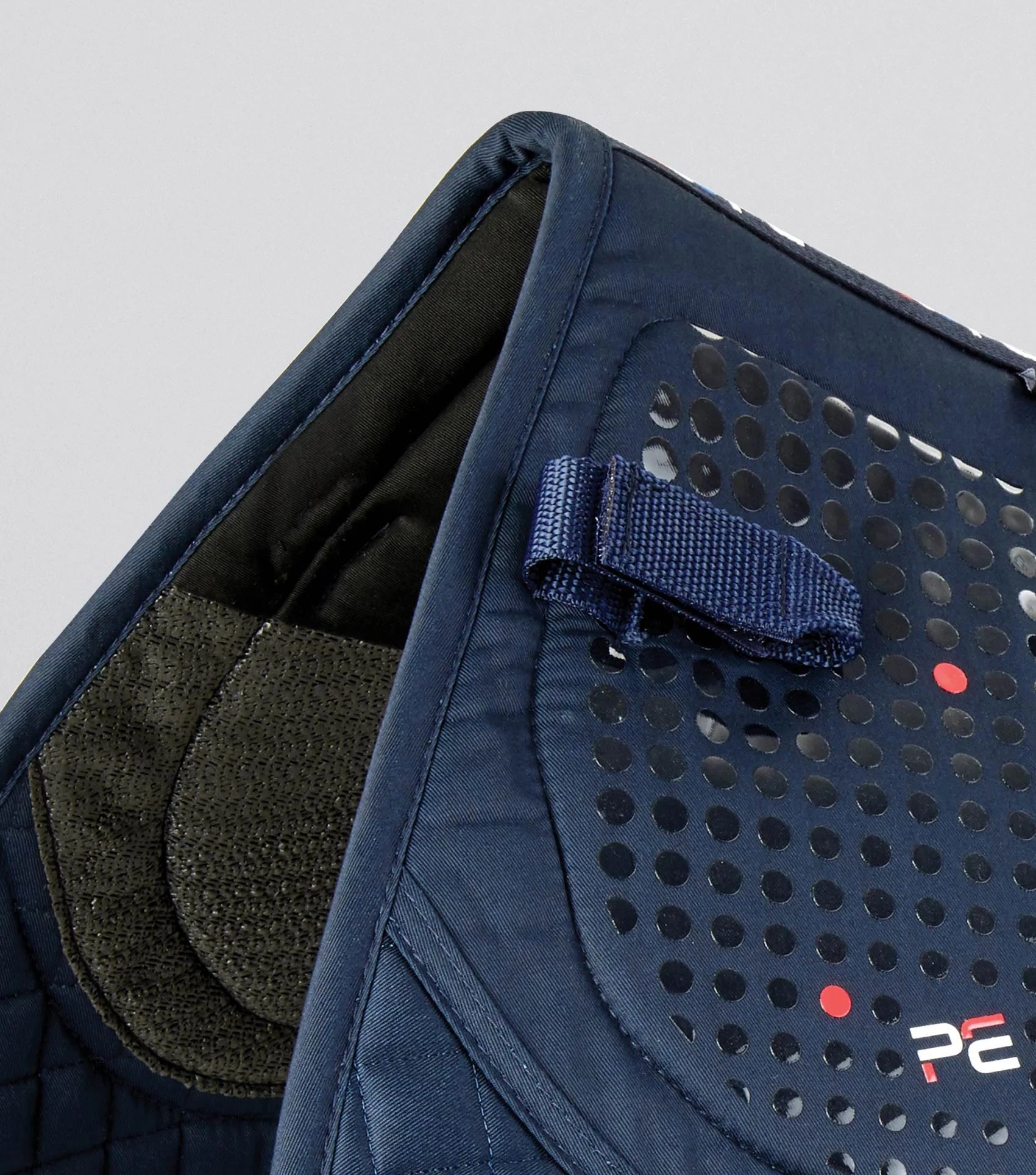 Close-up: Premier Equine Tech Grip Pro Anti-Slip GP/Jump Saddle Pad - Navy. Non-slip horse saddle pad detail.