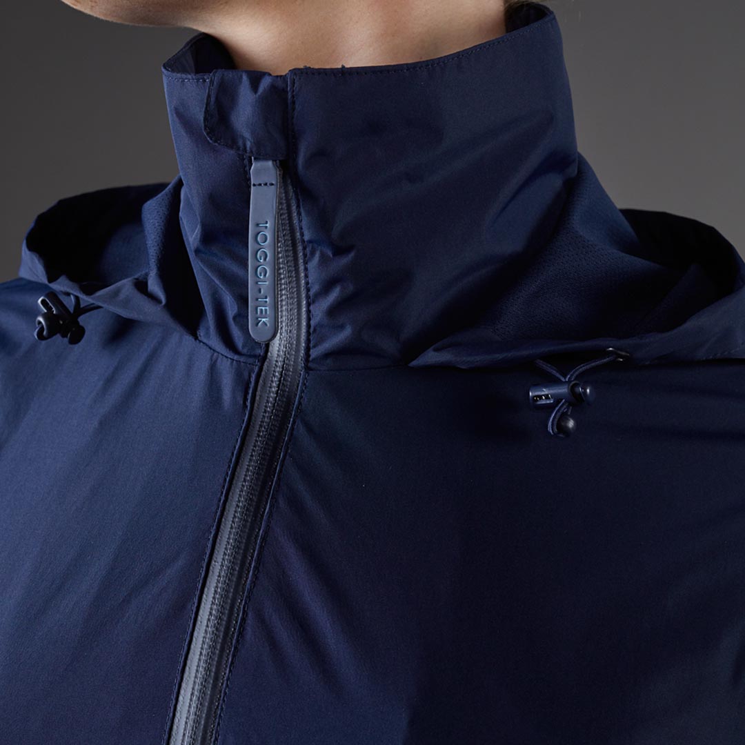 Toggi Defender Waterproof Jacket in navy blue with TOGGI-TEK zipper detail.