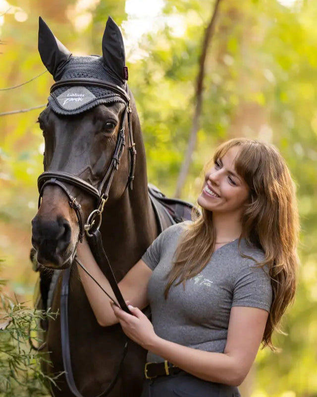 Woman with Horse wearing LEMIEUX EARTH FLY HOOD MOSS- Recycled Equestrian Gear
