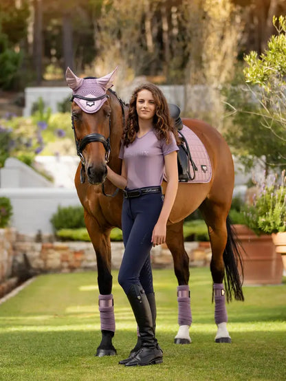 LeMieux Dynamique Breeches in Navy with Horse & Rider. Equestrian style in lilac & brown outfit. Shop now at Equiflair!