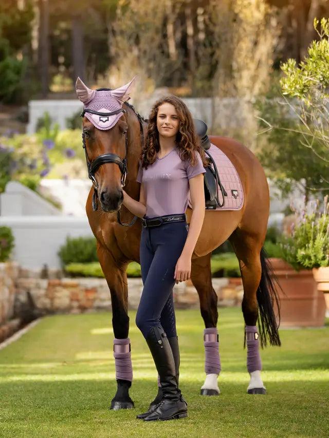 LeMieux Dynamique Breeches in Navy with Horse & Rider. Equestrian style in lilac & brown outfit. Shop now at Equiflair!