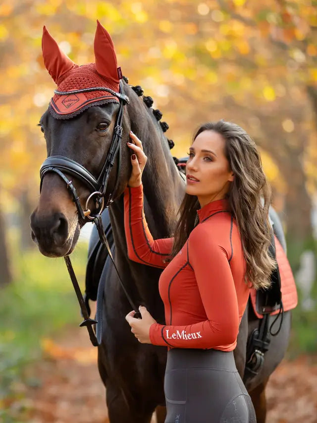 LeMieux Sienna Classic Fly Hood on Horse with Woman. Equestrian Style.