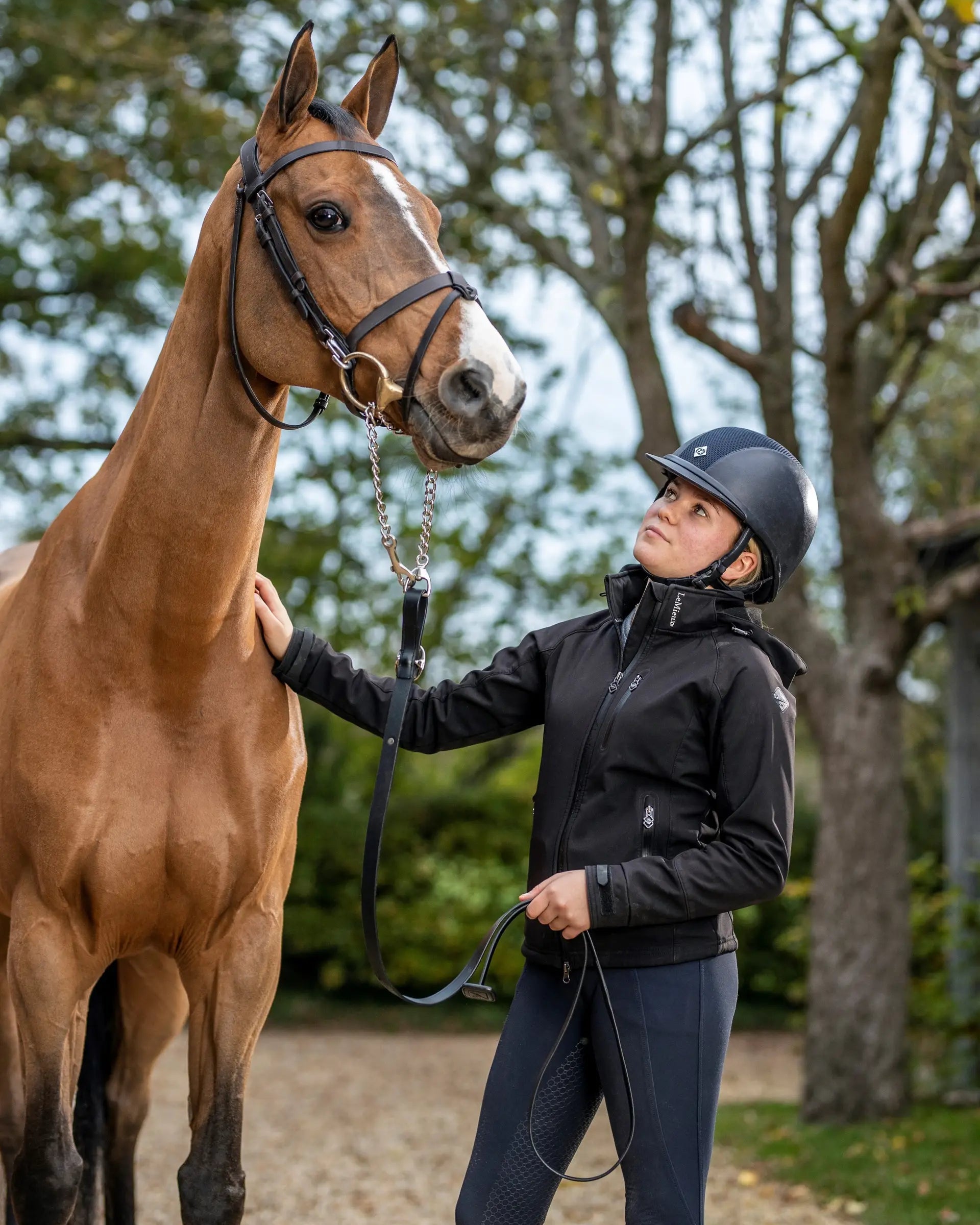 Woman with Horse wearing LeMieux Equestrian gear and brown Trot Up Chain