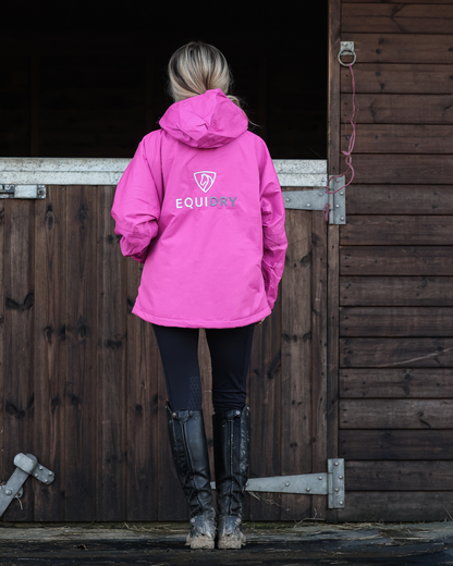 EQUIDRY Shortie Fuchsia Pink Waterproof Equestrian Jacket - Woman in Riding Boots by Stable